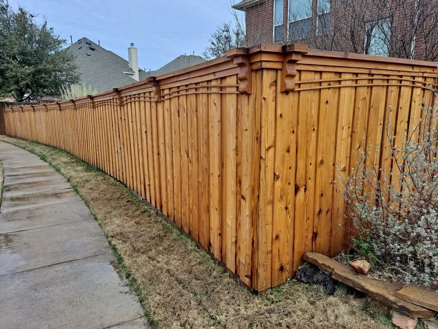 Wood privacy fence after pressure washing