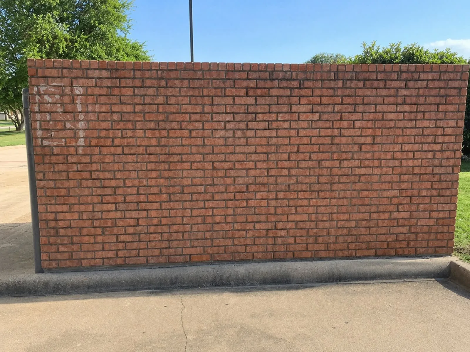 Clean brick building exterior after graffiti removal
