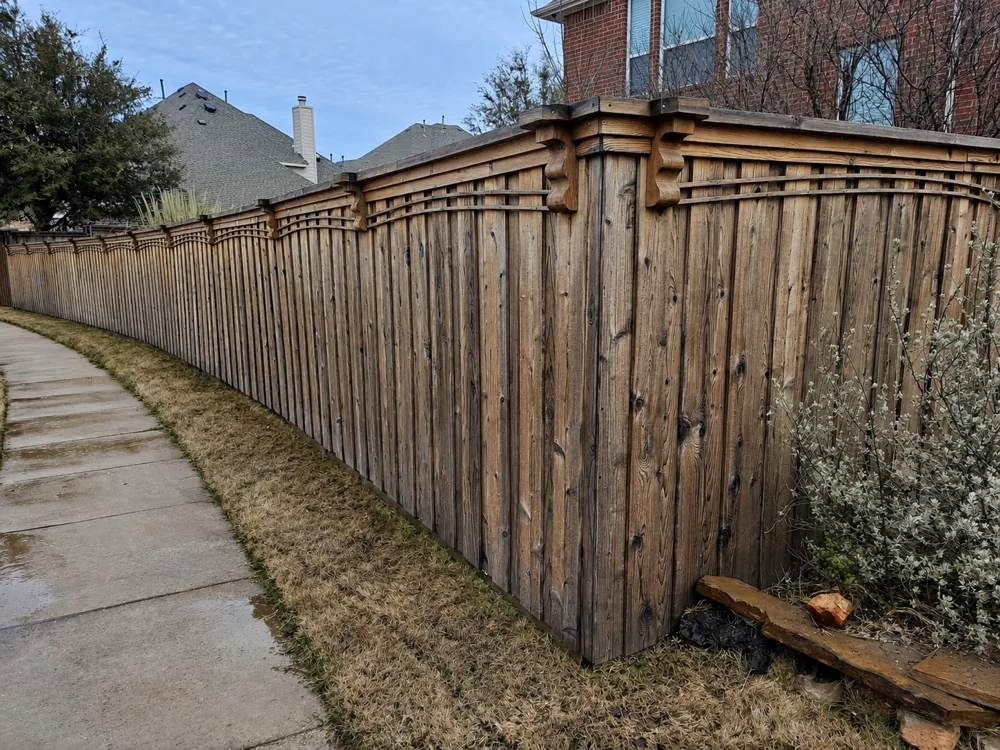 Weathered gray wood privacy fence before cleaning