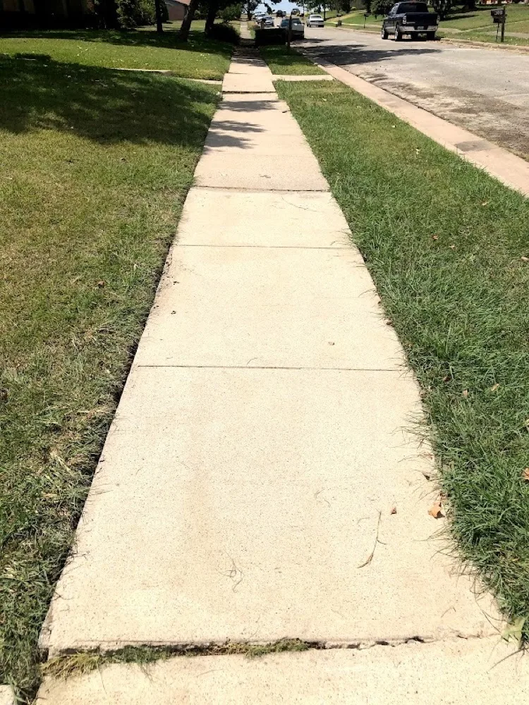 Residential concrete sidewalk clean after pressure washing