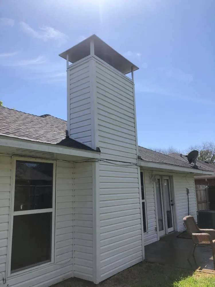 Clean white house siding after pressure washing