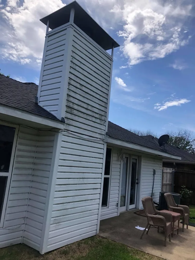 Dirty, mildew-stained house siding before soft washing